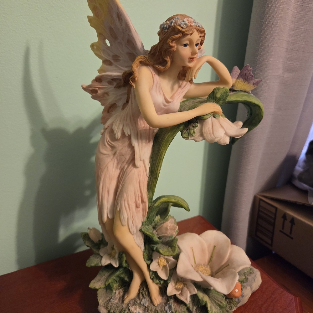 Elegant Fairy Figurine with Pink and Green Accents